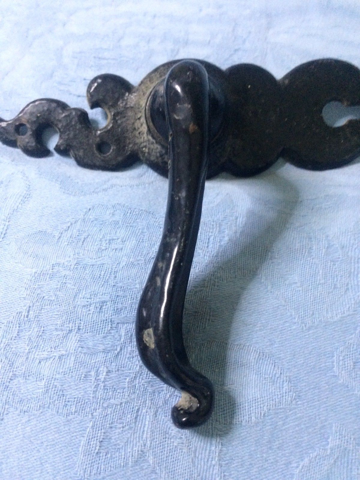 Two vintage cast Metal door handles and escutcheons