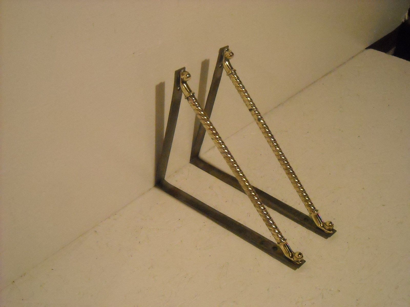 Pair of brass self brackets.