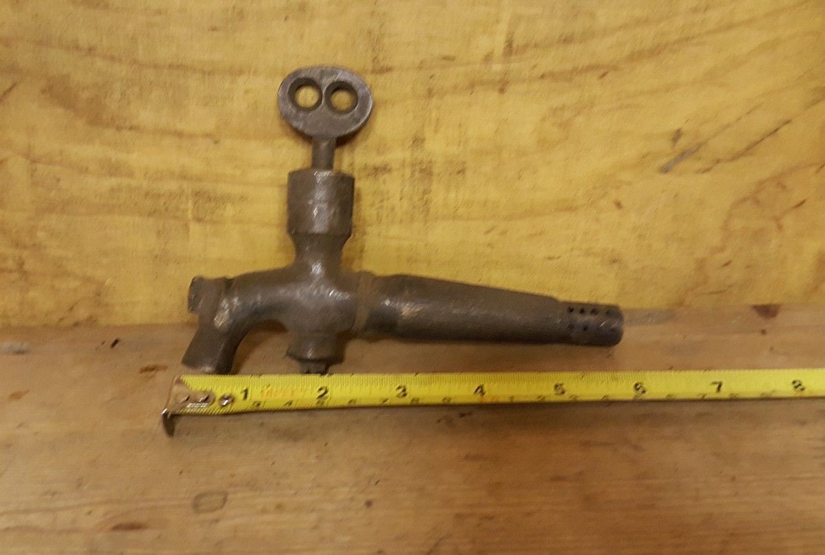 old vintage brass barrel tap with key