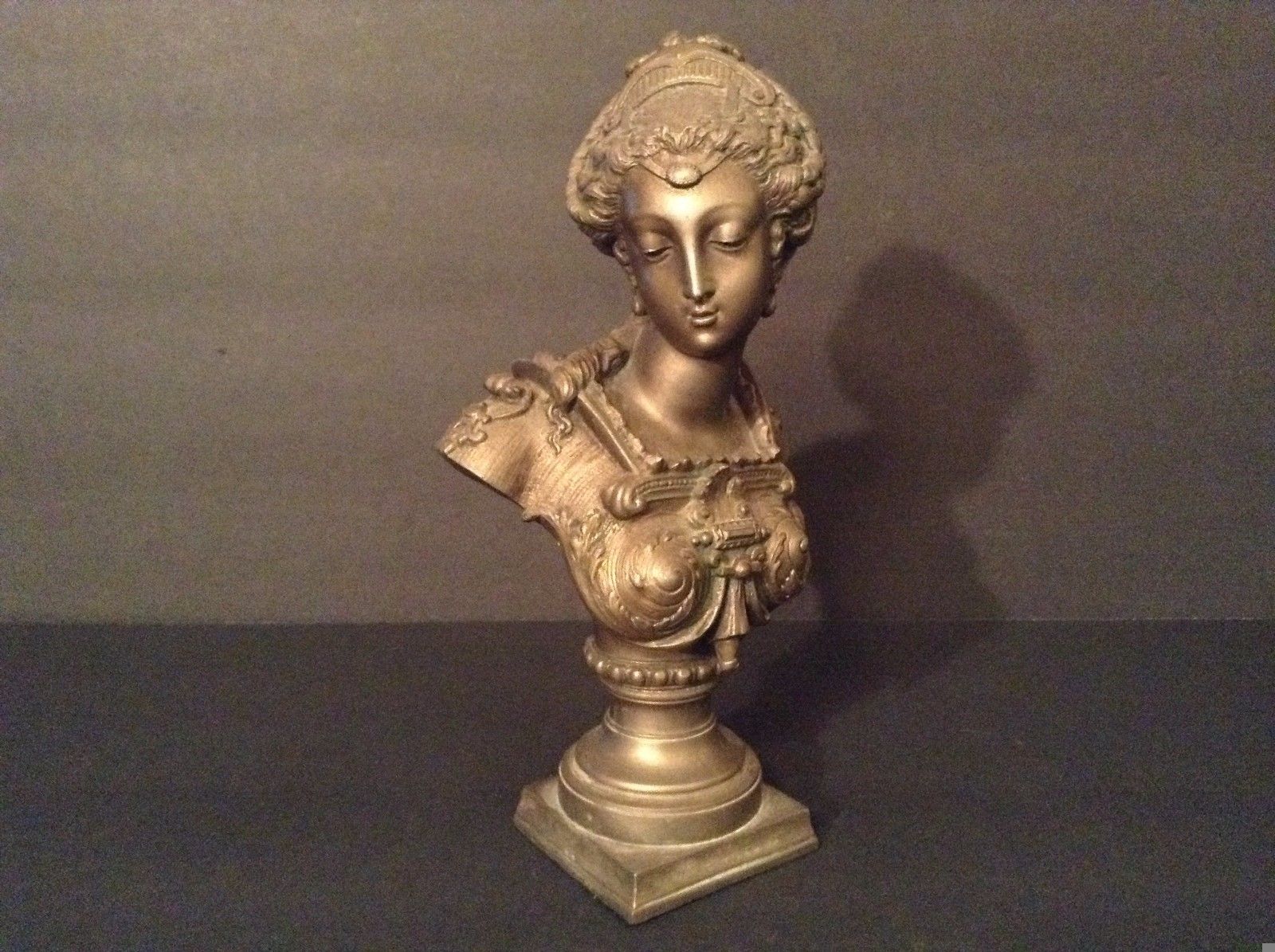 EUROPEAN BRONZE/ BRONZE-LIKE BUST OF A YOUNG WOMAN.