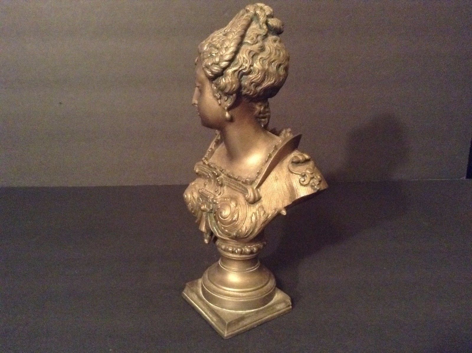 EUROPEAN BRONZE/ BRONZE-LIKE BUST OF A YOUNG WOMAN.