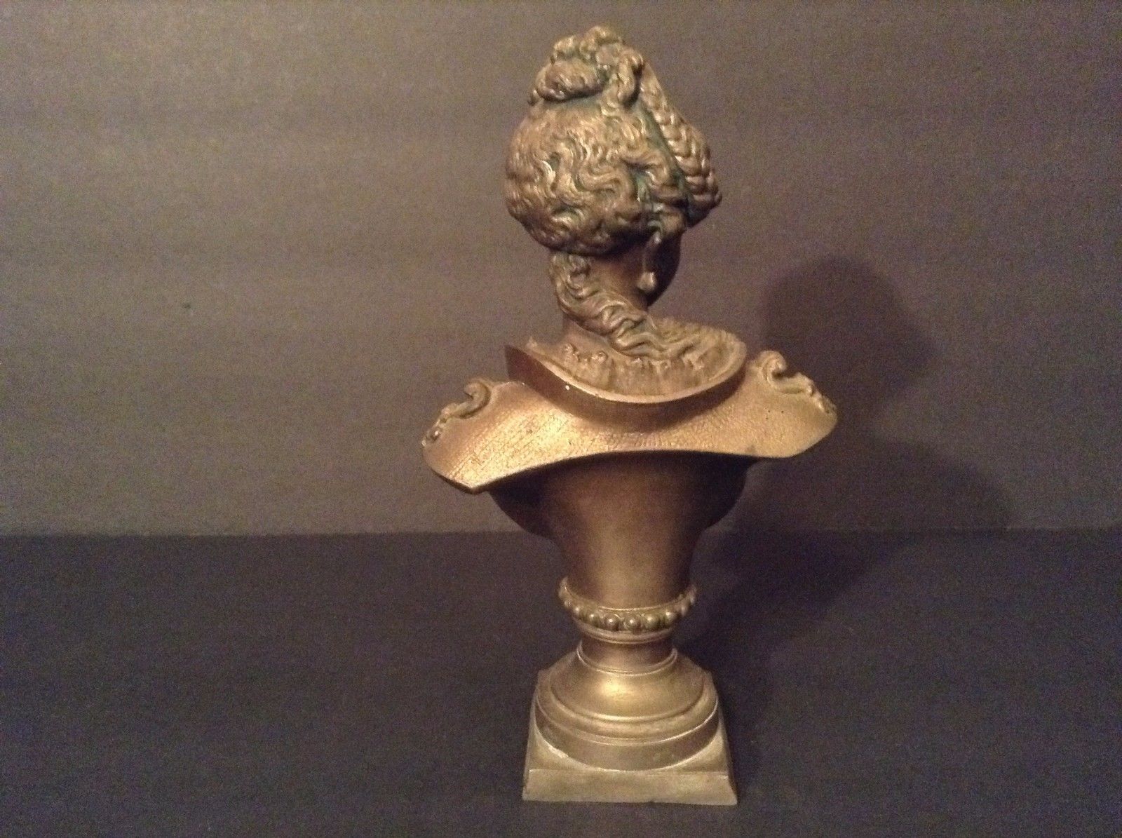 EUROPEAN BRONZE/ BRONZE-LIKE BUST OF A YOUNG WOMAN.