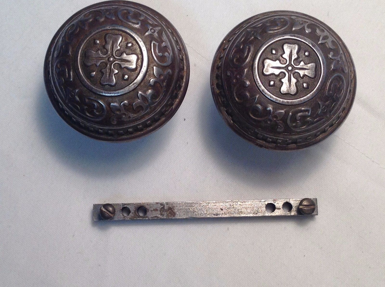 SET OF ANTIQUE ORNATE STEEL OR TIN DOOR KNOBS-WITH SPINDLE