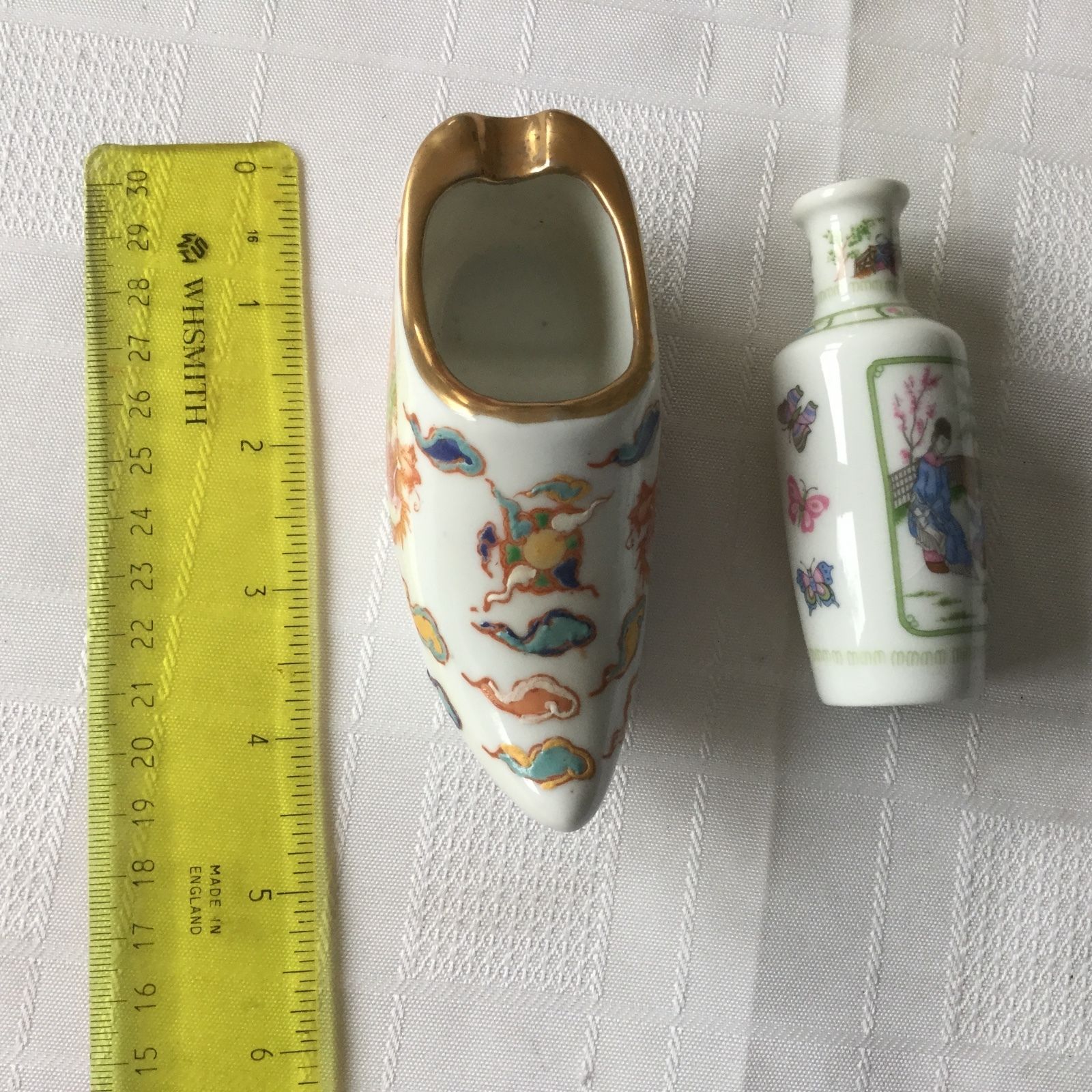 HAND PAINTED CHINESE PORCELAIN SHOE with characters plus bottle.