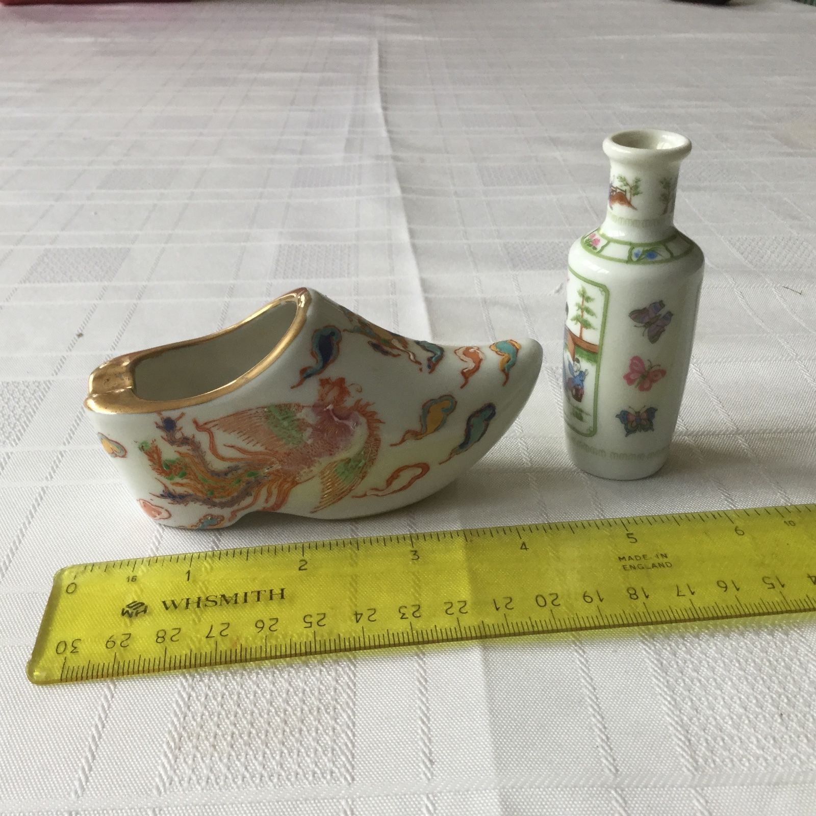 HAND PAINTED CHINESE PORCELAIN SHOE with characters plus bottle.