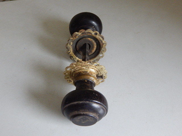 A very good pair of wood and brass antique doorknobs