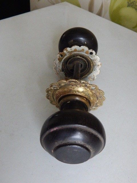 A very good pair of wood and brass antique doorknobs