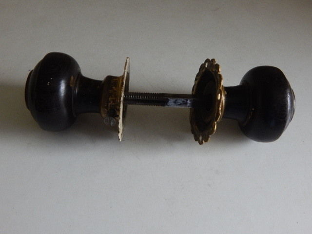 A very good pair of wood and brass antique doorknobs