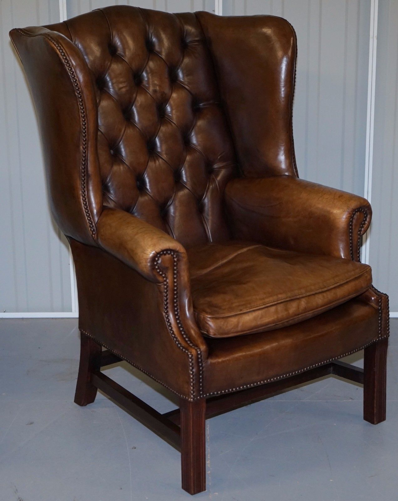 PAIR OF CHESTERFIELD VINTAGE BROWN LEATHER GEORGIAN STYLE WINGBACK ARMCHAIRS