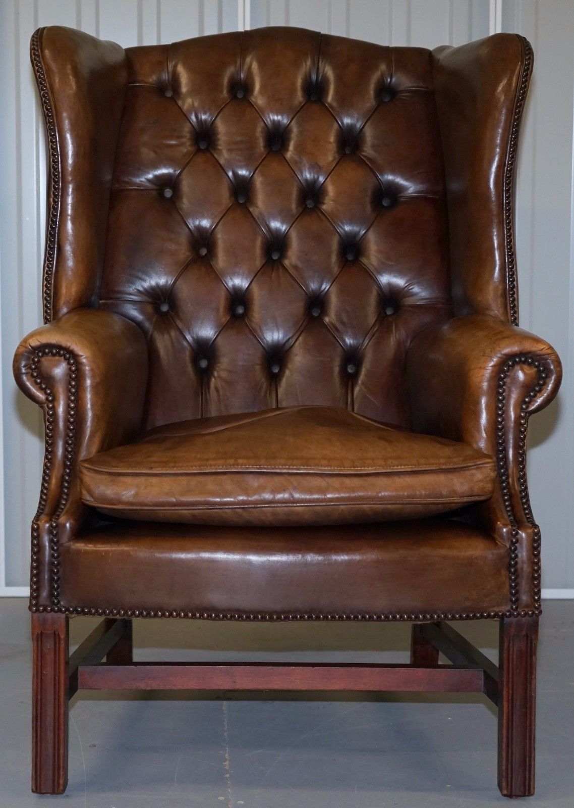 PAIR OF CHESTERFIELD VINTAGE BROWN LEATHER GEORGIAN STYLE WINGBACK ARMCHAIRS