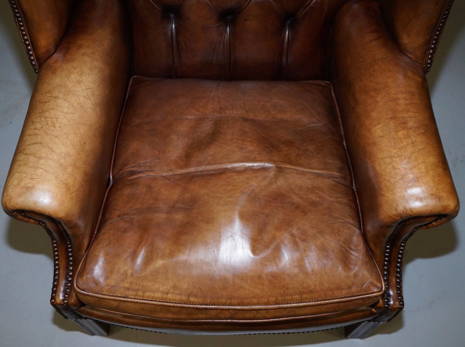 PAIR OF CHESTERFIELD VINTAGE BROWN LEATHER GEORGIAN STYLE WINGBACK ARMCHAIRS