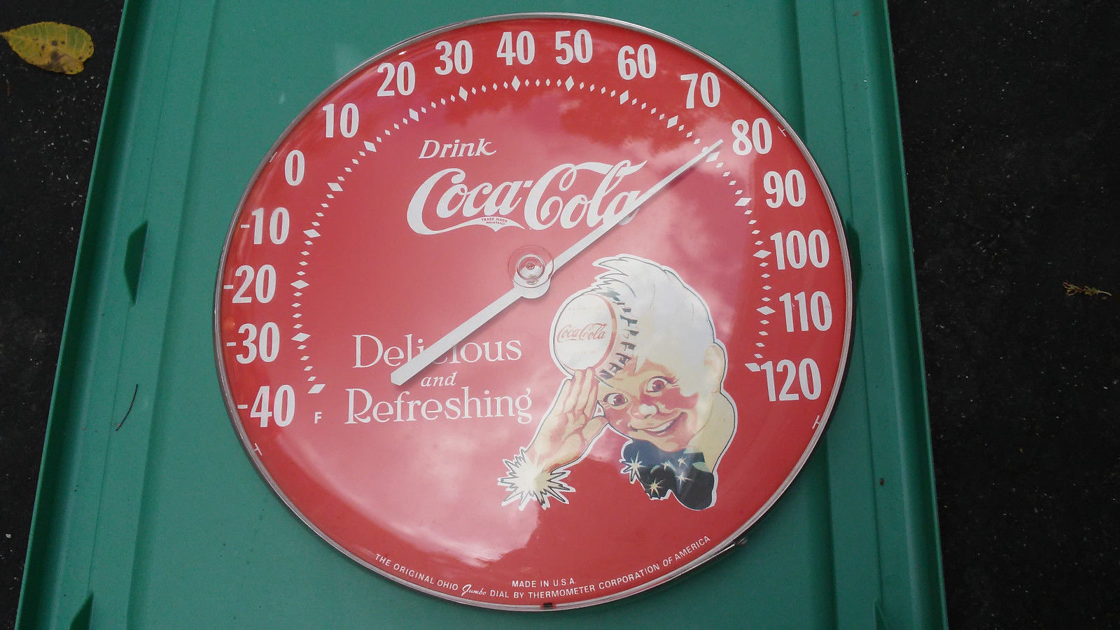 1980s red sprite boy coca cola round advertising thermometer in box.