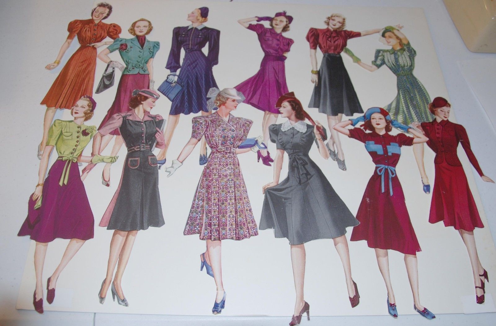 22 hand-cut paper dolls from 1940s