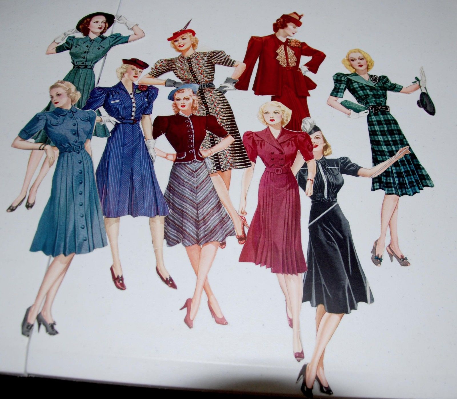 22 hand-cut paper dolls from 1940s