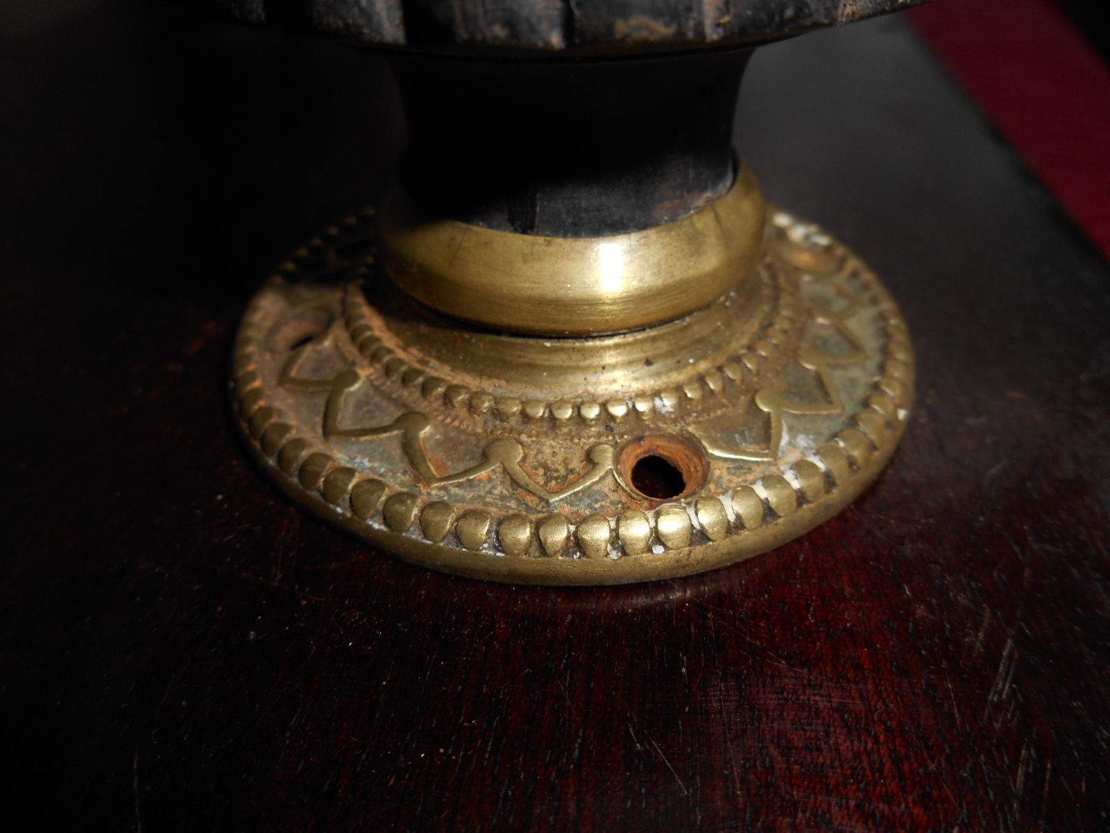 ANTIQUE EBONISED WOOD AND ORNATE CAST BRASS SINGLE DOOR KNOB AND FLANGE