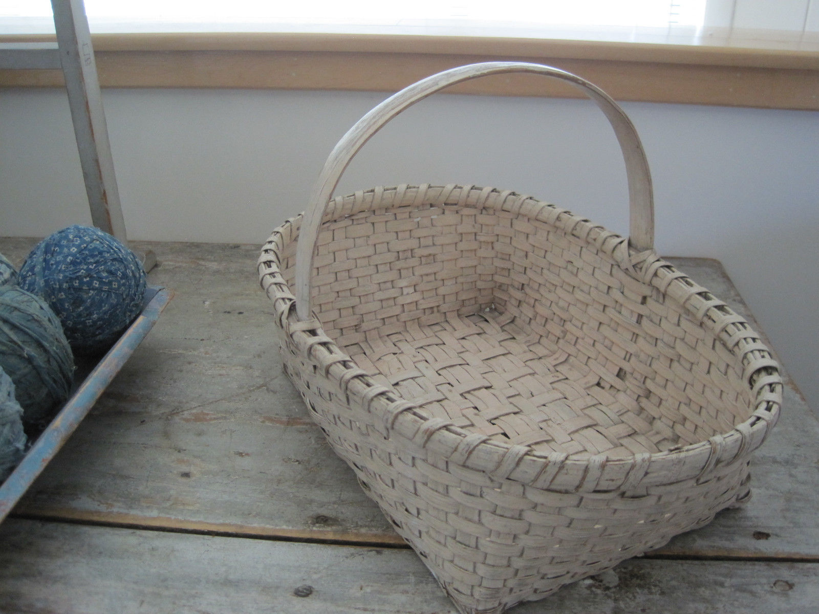 19th Century Old Cream Paint Heavy Basket with Three Wood Runners on the Bottom