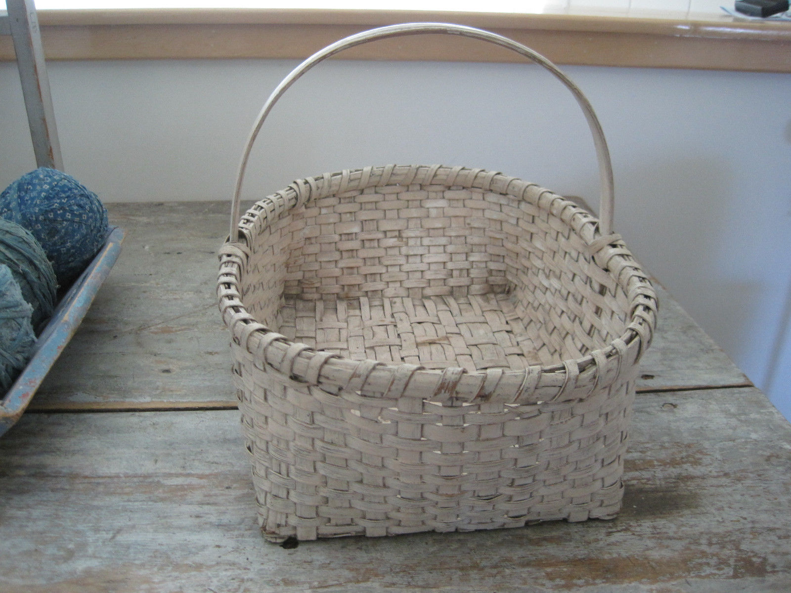 19th Century Old Cream Paint Heavy Basket with Three Wood Runners on the Bottom