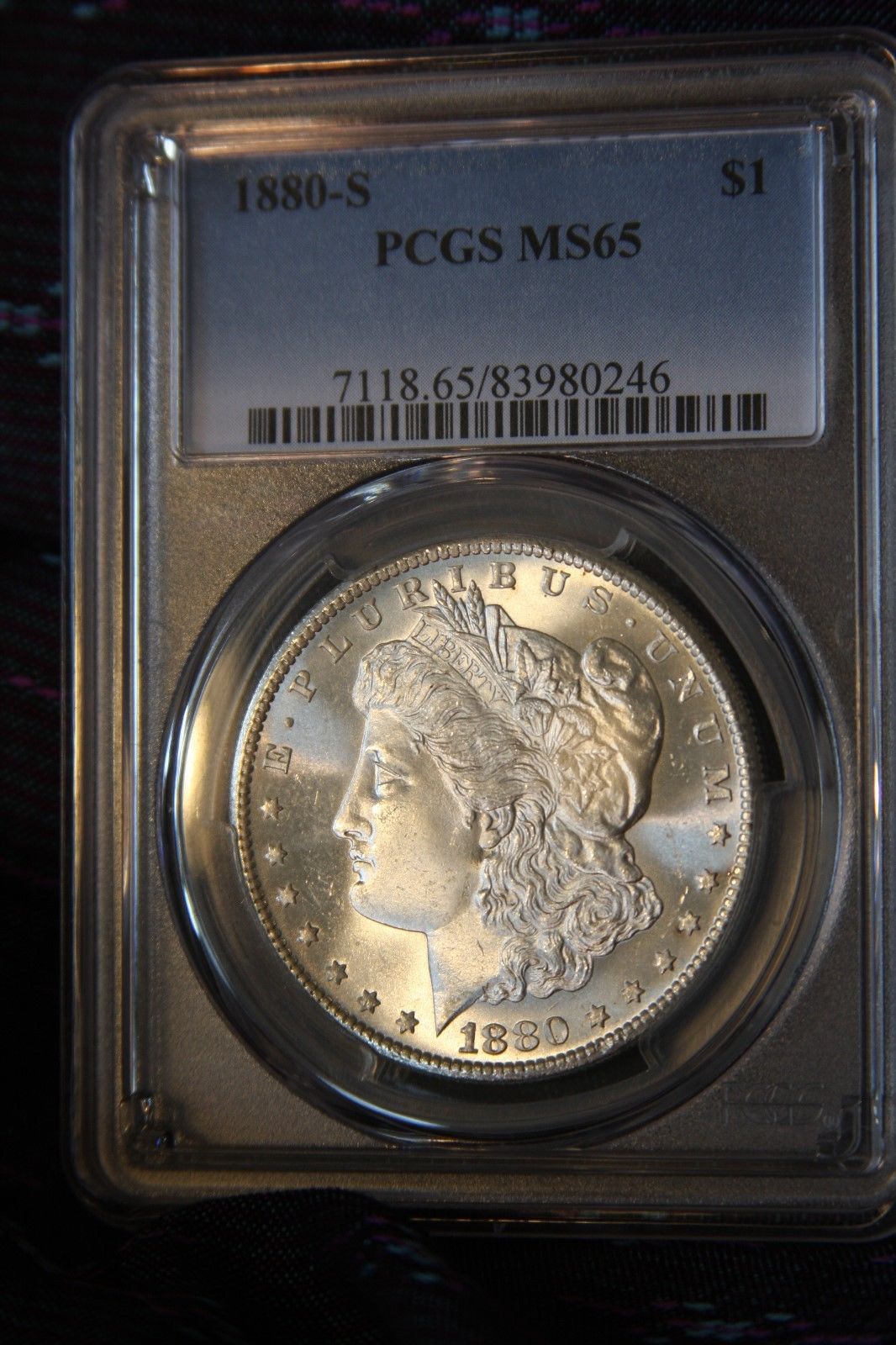 1880 S Morgan Silver Dollar graded MS65 by PCGS, a gem.