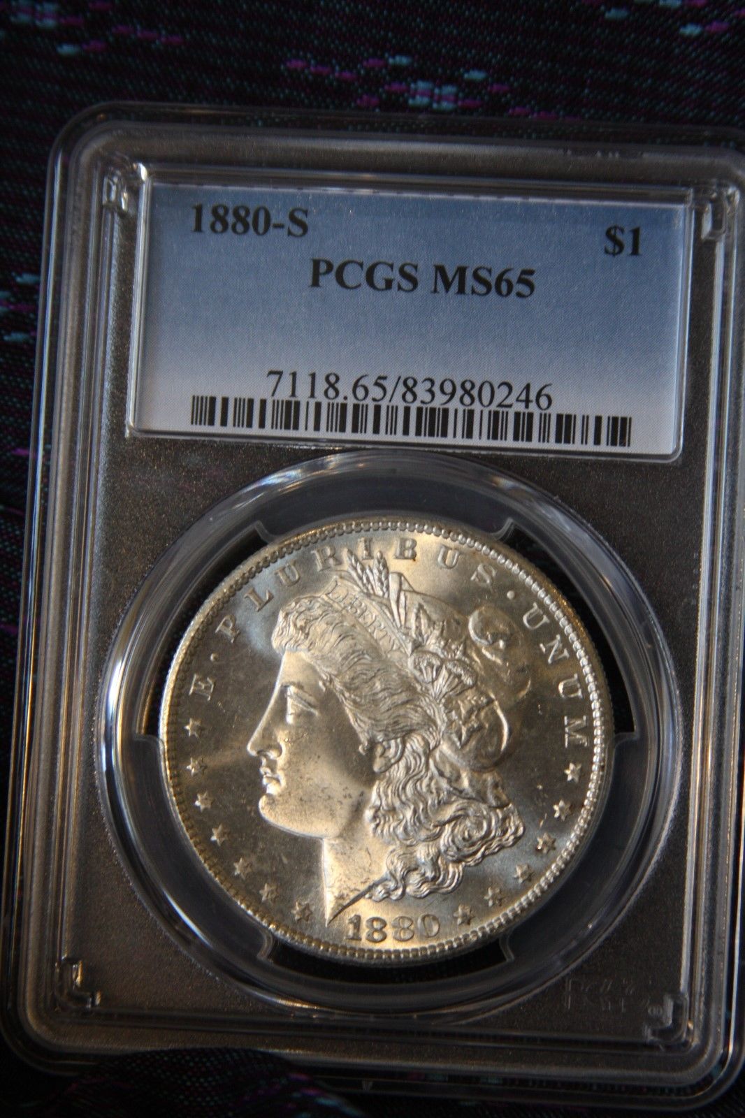 1880 S Morgan Silver Dollar graded MS65 by PCGS, a gem.