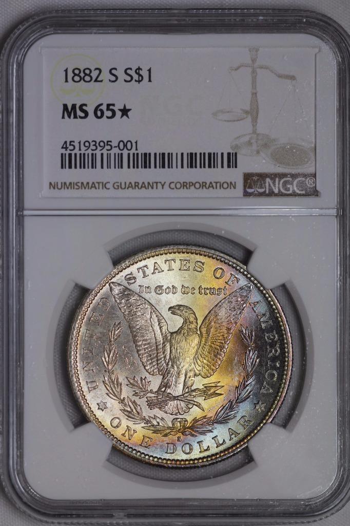 1882 S Morgan Silver Dollar MS65* NGC $1 Rainbow Toned United States Mint Coin