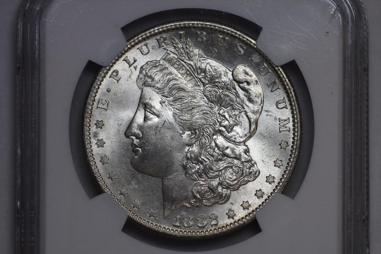 1882 S Morgan Silver Dollar MS65* NGC $1 Rainbow Toned United States Mint Coin