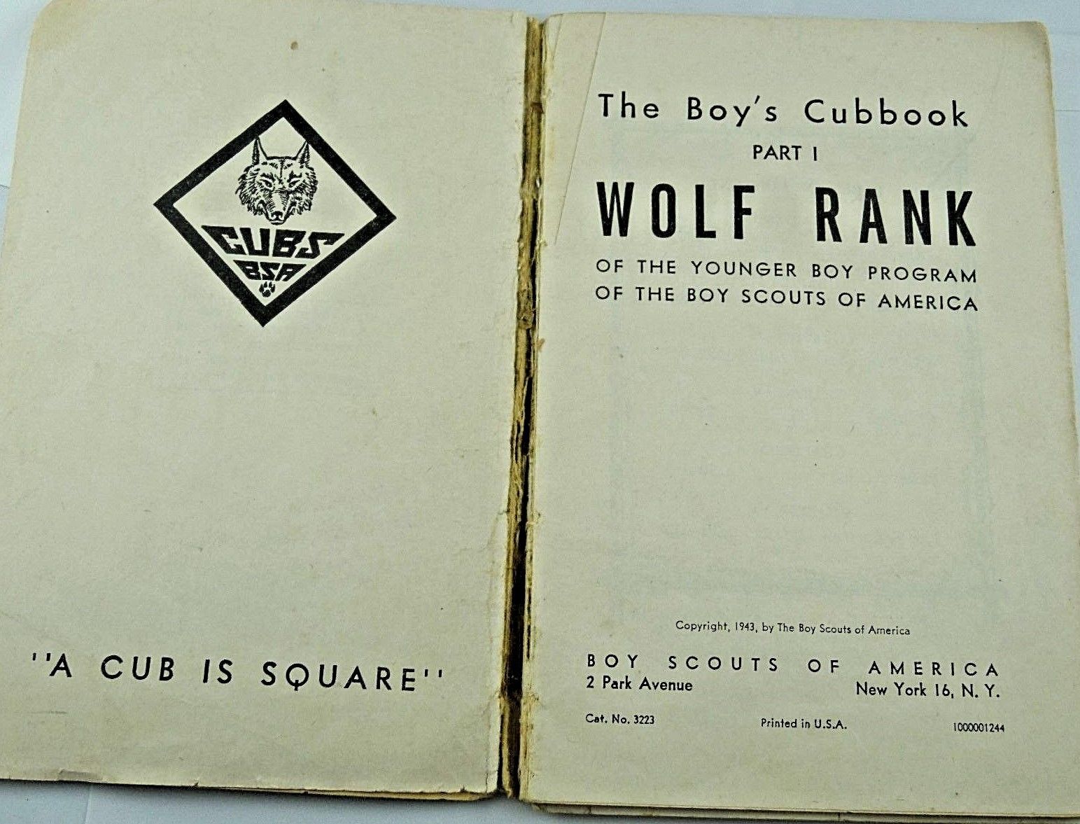 A VINTAGE 1943 BOY SCOUTS OF AMERICA "THE WOLF CUBBOOK"