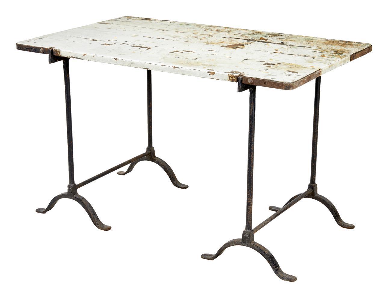 EARLY 20TH CENTURY PINE AND IRON TRESTLE WORK TABLE