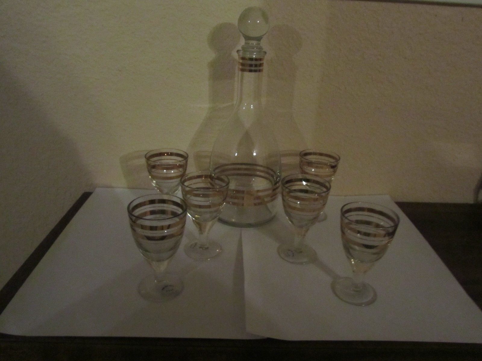 VINTAGE  USSR CLEAR CRYSTAL DECANTER WITH GOLD BANDS AND 6 CORDIAL GLASSES