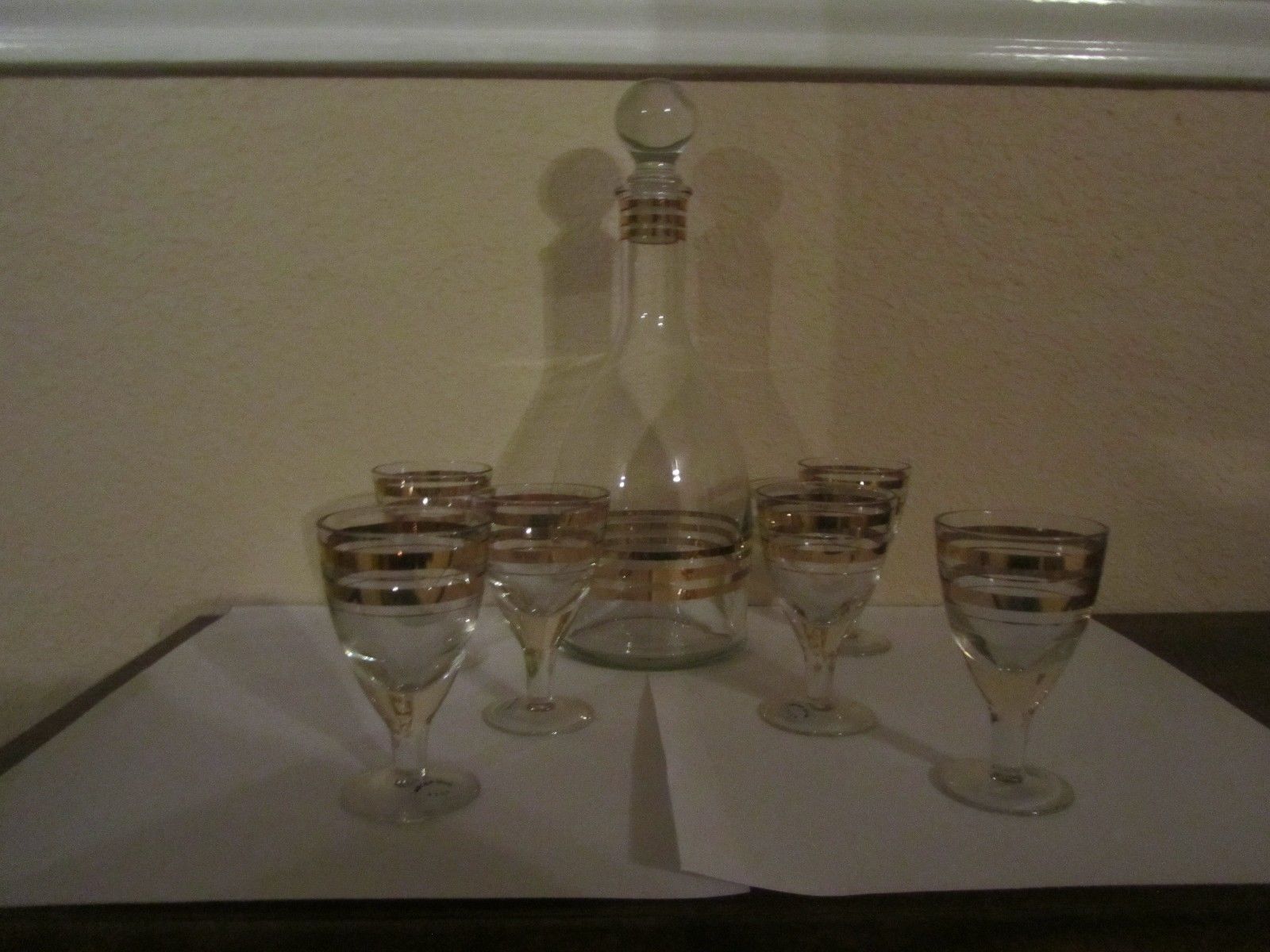 VINTAGE  USSR CLEAR CRYSTAL DECANTER WITH GOLD BANDS AND 6 CORDIAL GLASSES