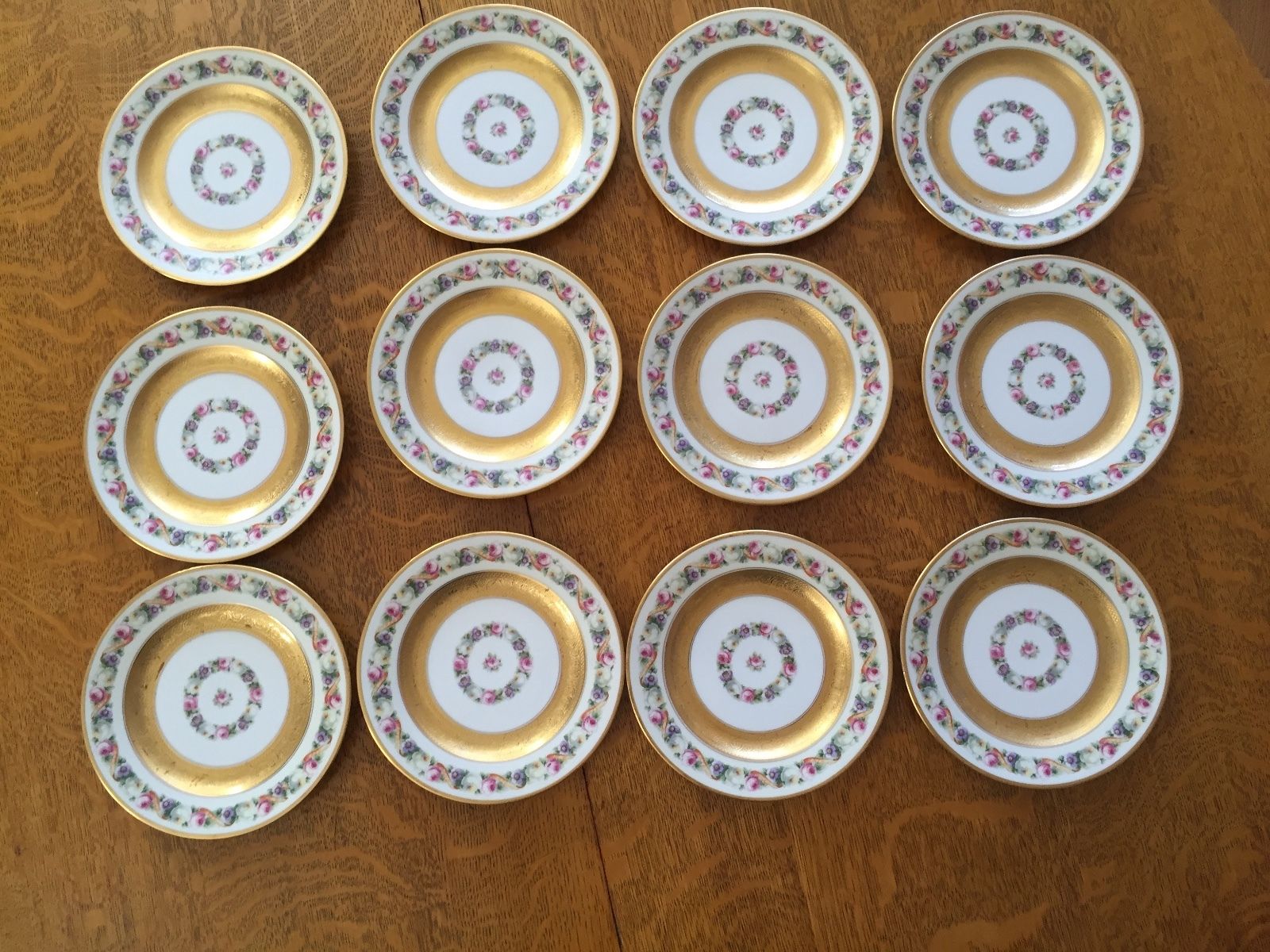 VINTAGE SET OF 12  BLACK KNIGHT PORCELAIN DESSERT PLATES W/ GOLD ENCRUSTATION