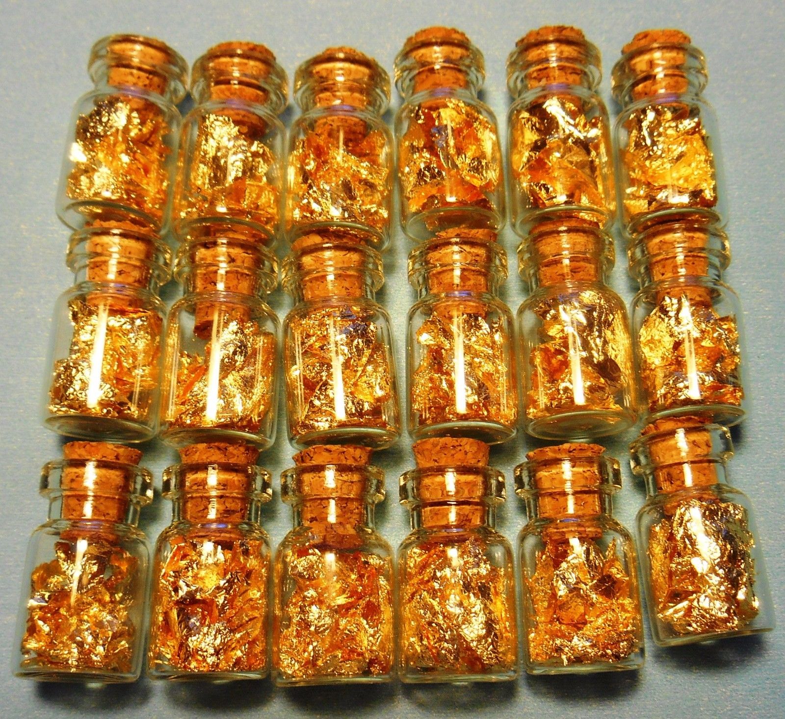 24k GOLD leaf flakes in 20 glass vials ¾X½ inch each sealed with cork NO LIQUID