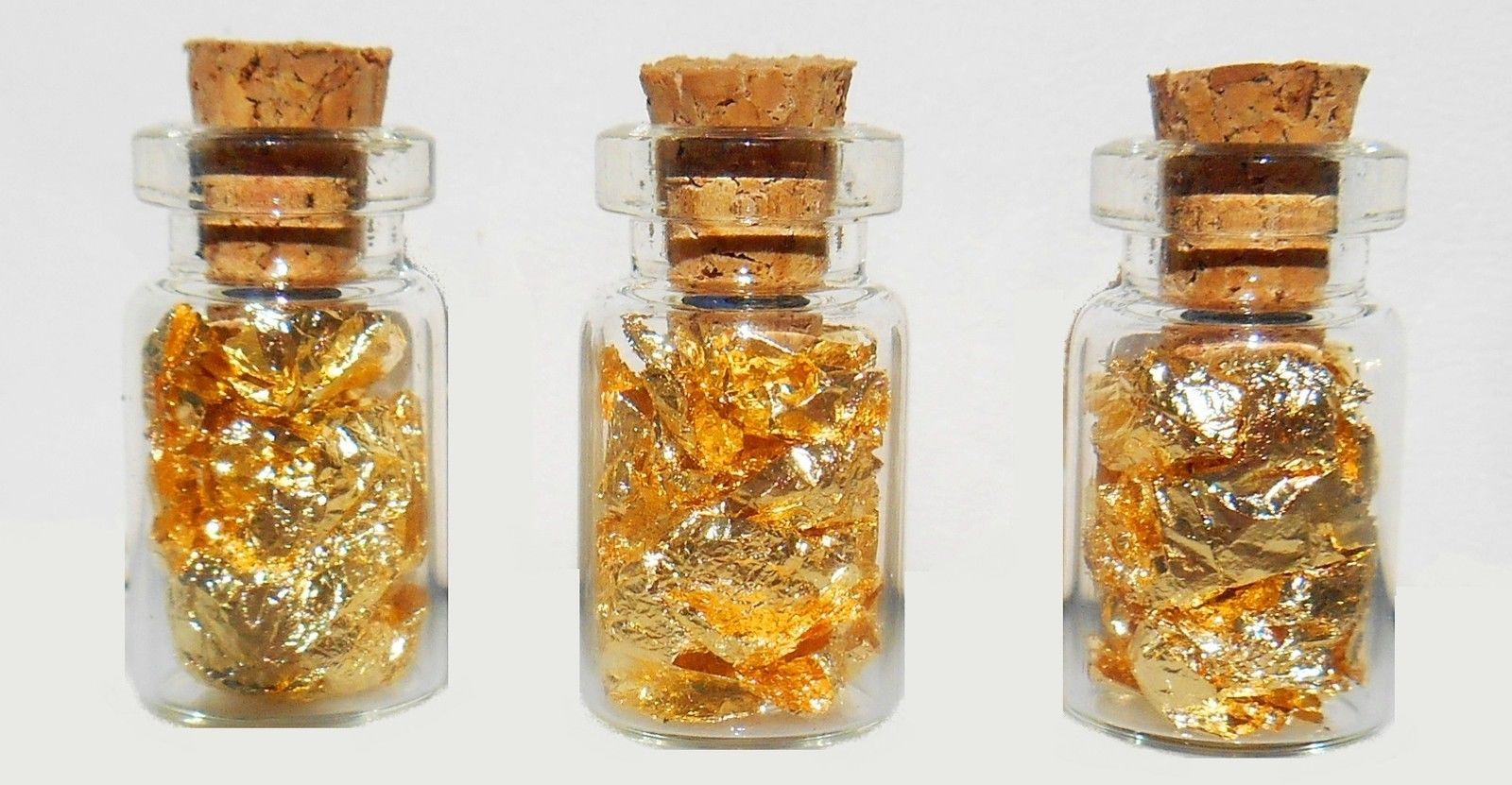 24k GOLD leaf flakes in 20 glass vials ¾X½ inch each sealed with cork NO LIQUID