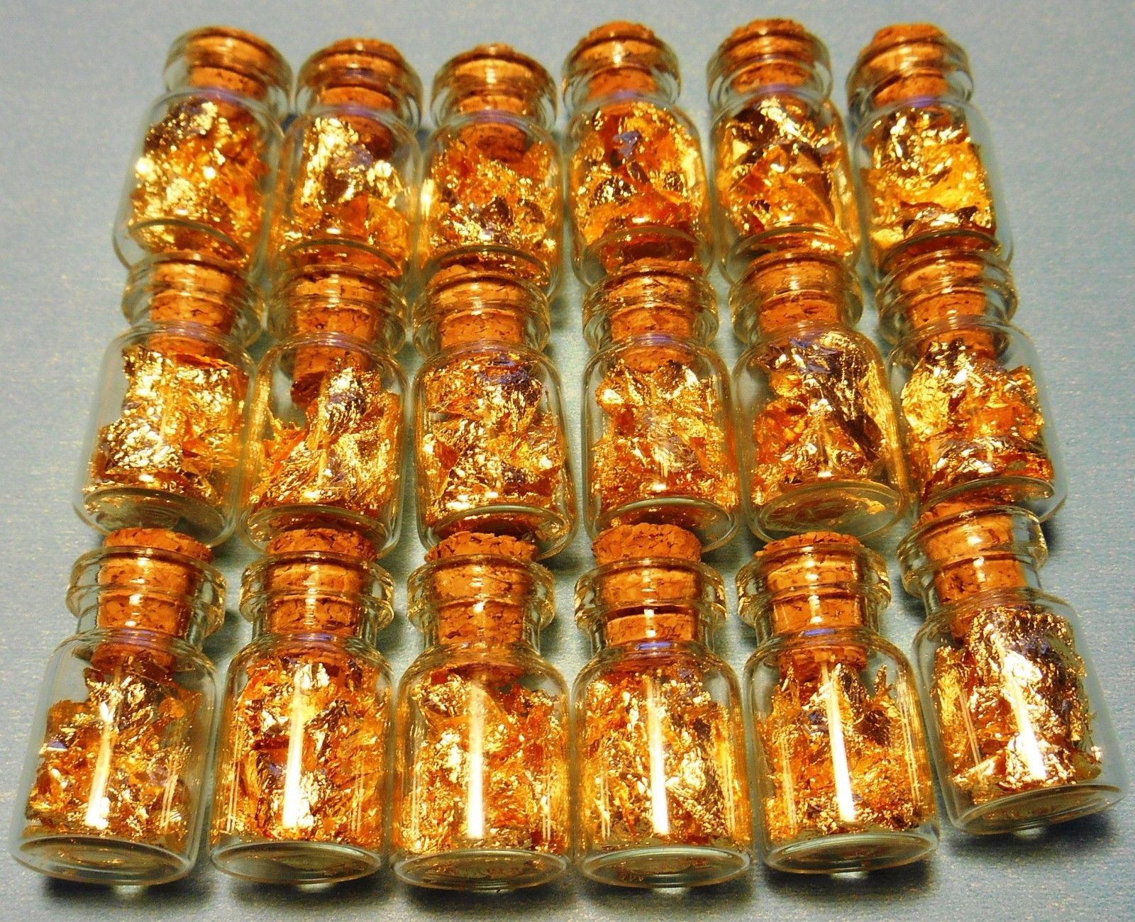 24k GOLD leaf flakes in 20 glass vials ¾X½ inch each sealed with cork NO LIQUID